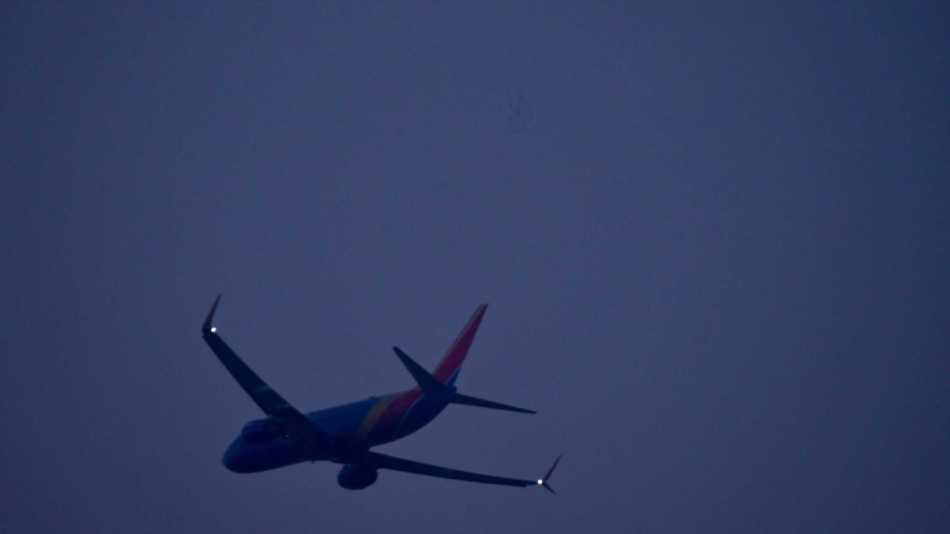Moon with Southwest plane over Las Vegas — Ian Palast personal photography