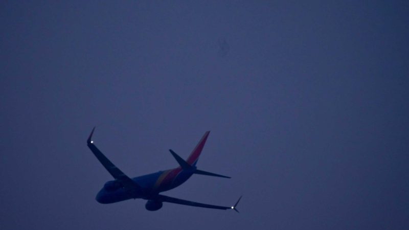 Moon with Southwest plane over Las Vegas — Ian Palast personal photography